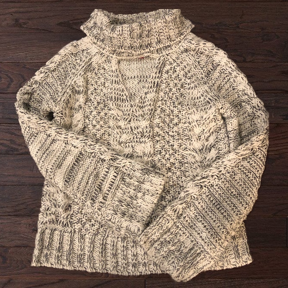 Jennifer Lopez Cut Out Cable Knit Turtleneck